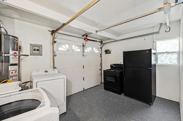 garage with washer / dryer, gas water heater, and black fridge