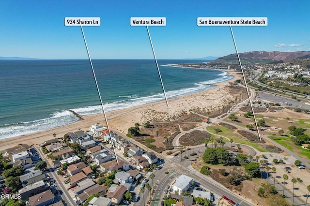 birds eye view of property featuring a water view and a view of the beach