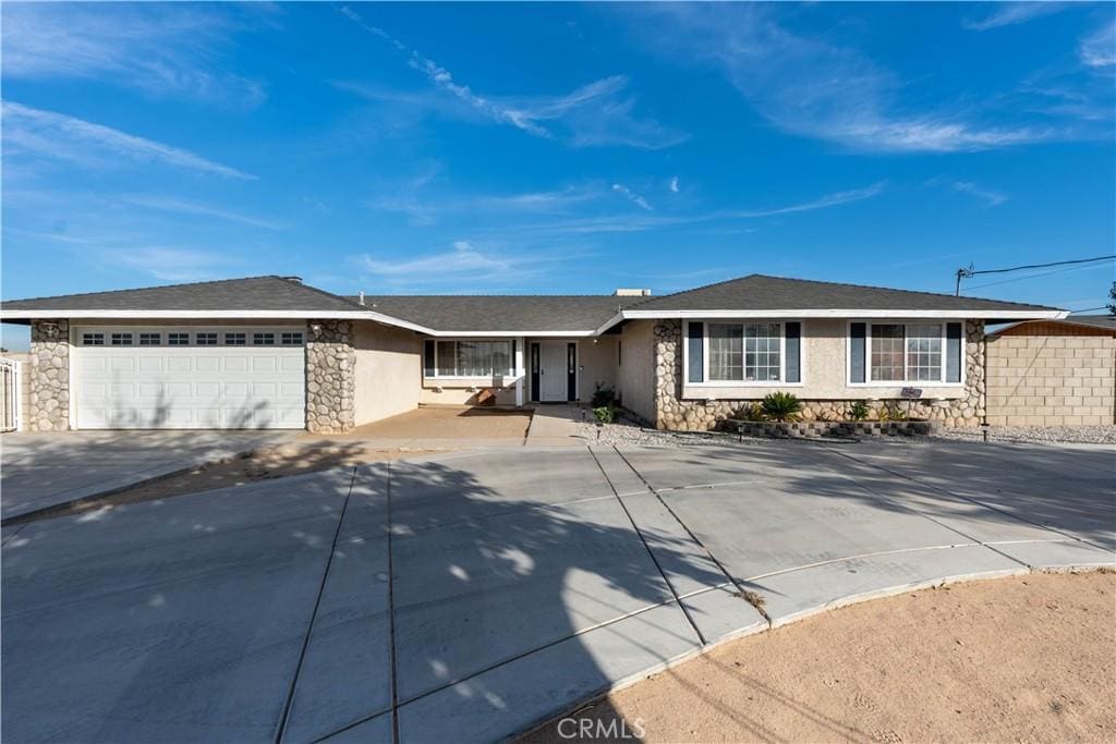 single story home featuring a garage