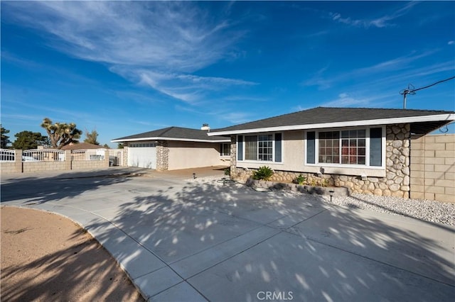 single story home featuring a garage