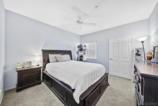 bedroom featuring light carpet and ceiling fan