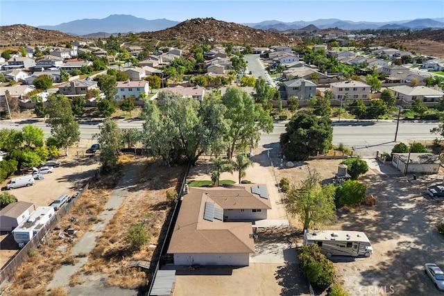 birds eye view of property featuring a mountain view