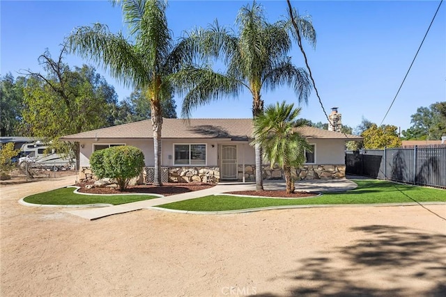 single story home with a front yard