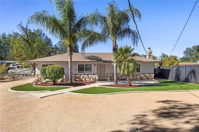 single story home with a front yard