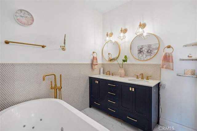 bathroom with vanity, a tub to relax in, and tile walls