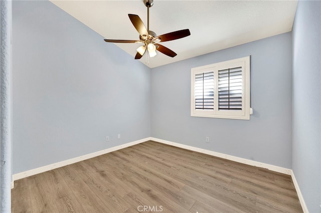 spare room featuring ceiling fan and light hardwood / wood-style flooring