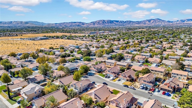 birds eye view of property with a mountain view