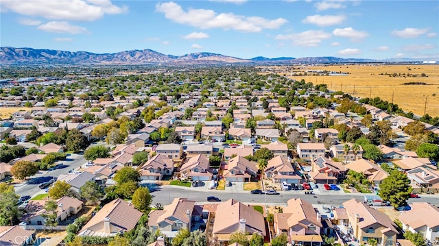 drone / aerial view featuring a mountain view