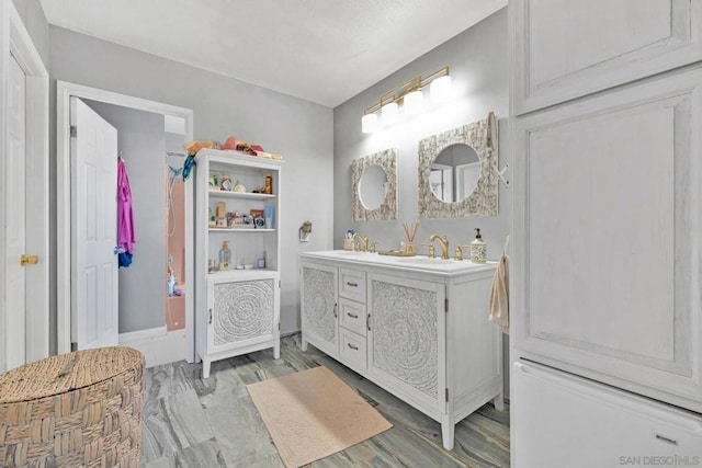 bathroom featuring vanity and hardwood / wood-style flooring