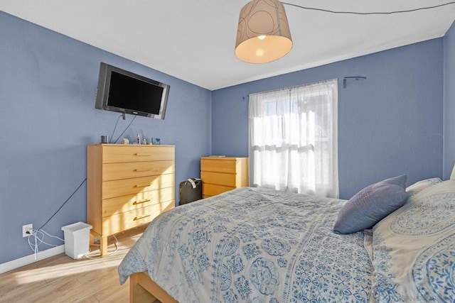 bedroom featuring wood-type flooring