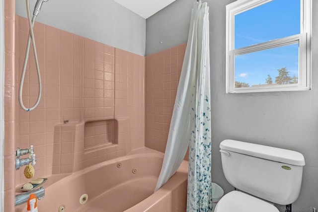 bathroom with shower / tub combo and toilet