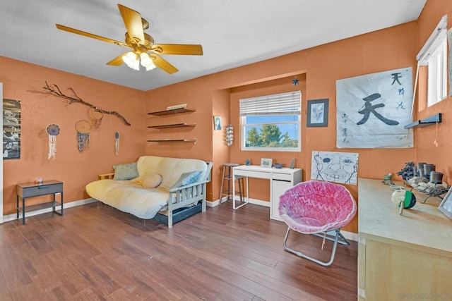 interior space featuring ceiling fan and dark hardwood / wood-style floors