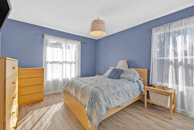 bedroom featuring light wood-type flooring