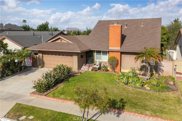 view of front of home with a garage and a front yard