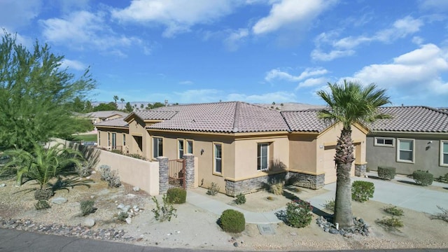 rear view of house featuring a garage