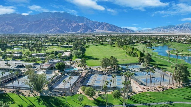 drone / aerial view with a water and mountain view