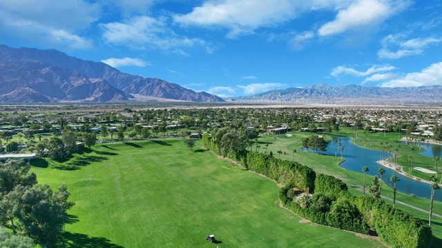 drone / aerial view featuring a water and mountain view