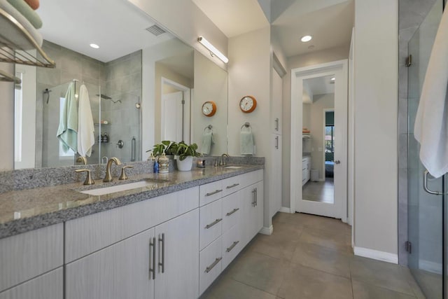 bathroom with an enclosed shower and vanity