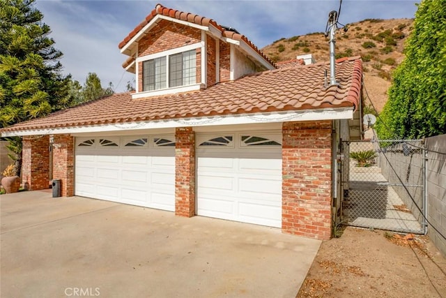 view of front of house featuring a mountain view and a garage