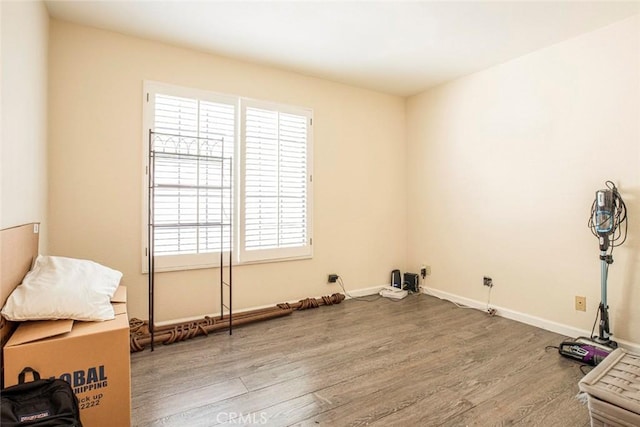 empty room with wood-type flooring