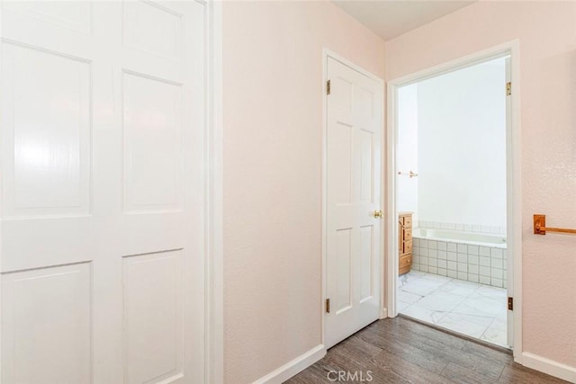 hallway featuring dark hardwood / wood-style floors