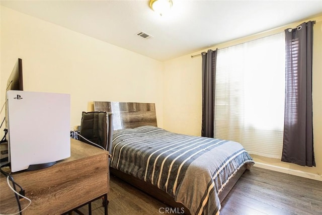 bedroom featuring dark wood-type flooring