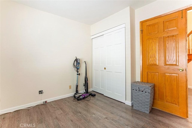 exercise room with hardwood / wood-style flooring