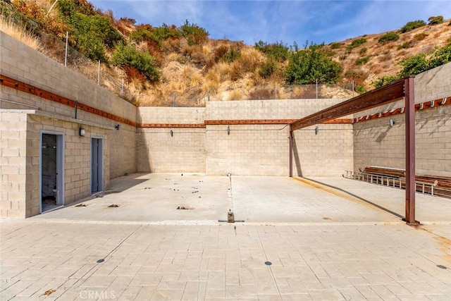 view of patio / terrace featuring a mountain view