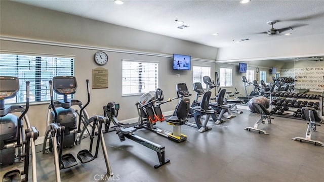 workout area featuring ceiling fan and a textured ceiling