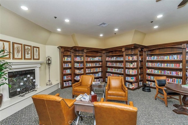 living area featuring carpet