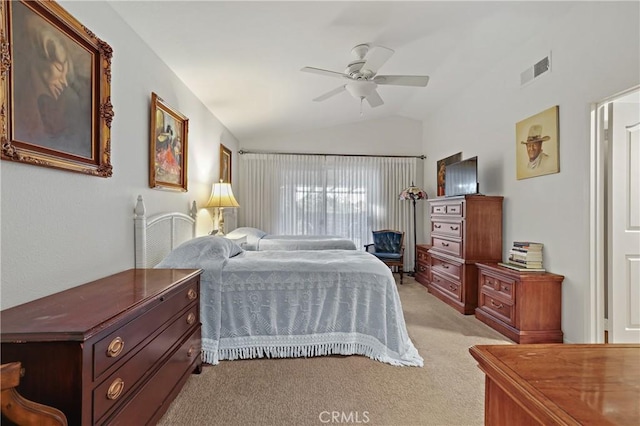 bedroom featuring ceiling fan, light colored carpet, and vaulted ceiling