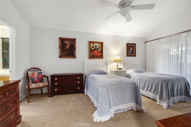 carpeted bedroom featuring lofted ceiling and ceiling fan