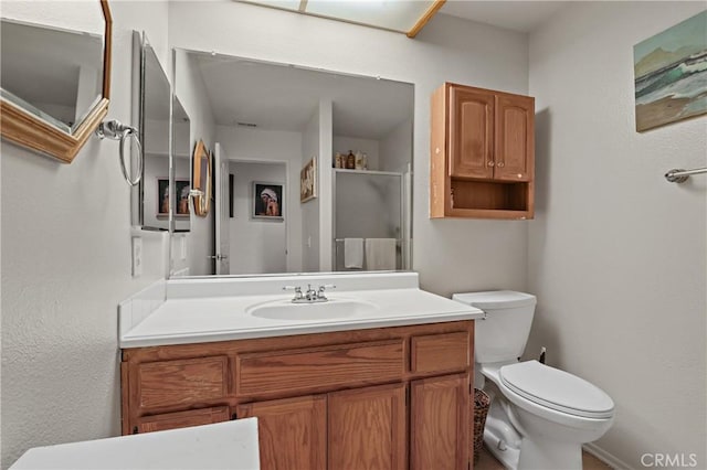 bathroom with toilet and vanity