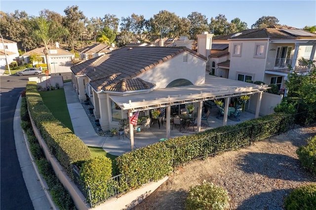 back of property with a patio