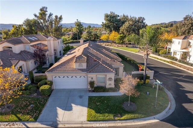 view of front facade with a front yard and a garage