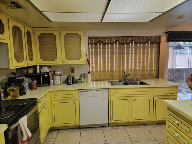 kitchen featuring sink, light tile patterned flooring, and stainless steel appliances