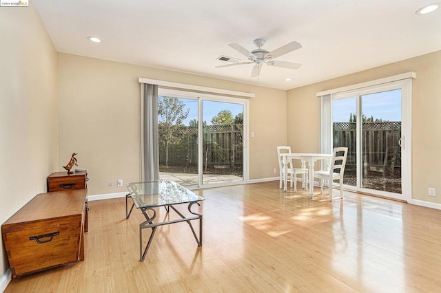 sitting room featuring ceiling fan, light hardwood / wood-style flooring, and plenty of natural light