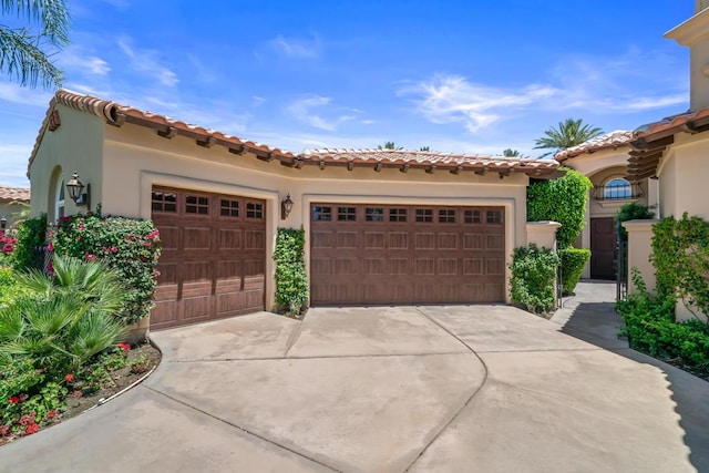 mediterranean / spanish-style house featuring a garage