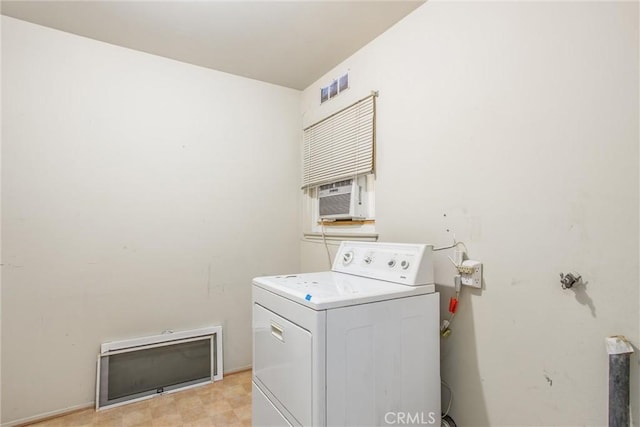 washroom featuring cooling unit and washer / dryer