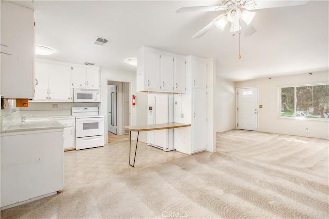 kitchen with ceiling fan, white appliances, sink, and white cabinets