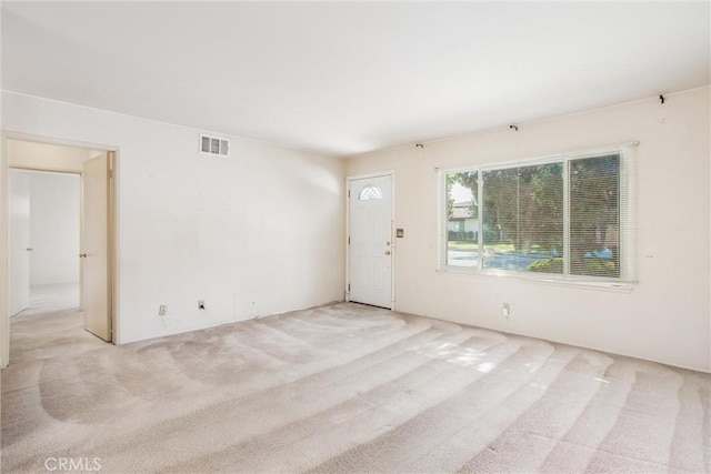 empty room featuring light colored carpet