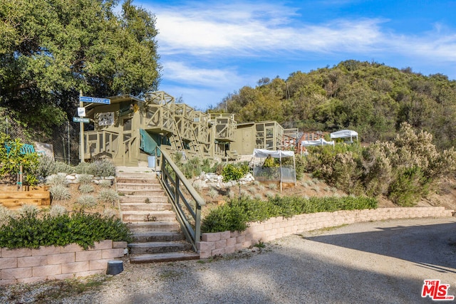 view of jungle gym with an outbuilding