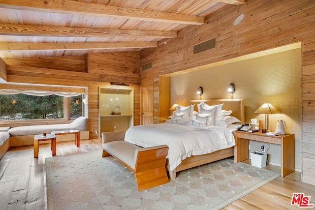 bedroom with vaulted ceiling with beams, light hardwood / wood-style flooring, and wood ceiling