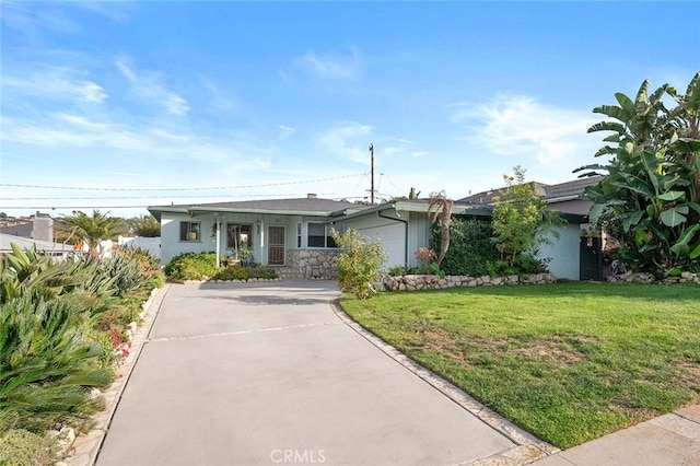 ranch-style home with a front yard and a garage