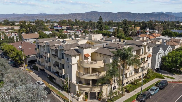 birds eye view of property featuring a mountain view