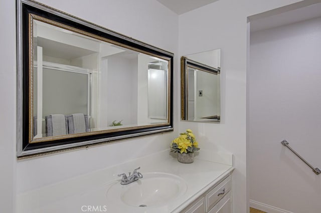 bathroom with vanity and an enclosed shower