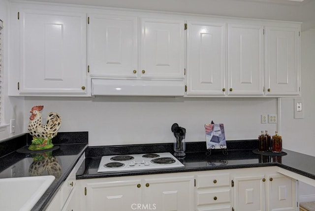 kitchen featuring white cabinets and white electric stovetop