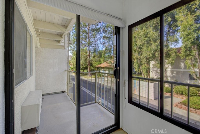 unfurnished sunroom with plenty of natural light