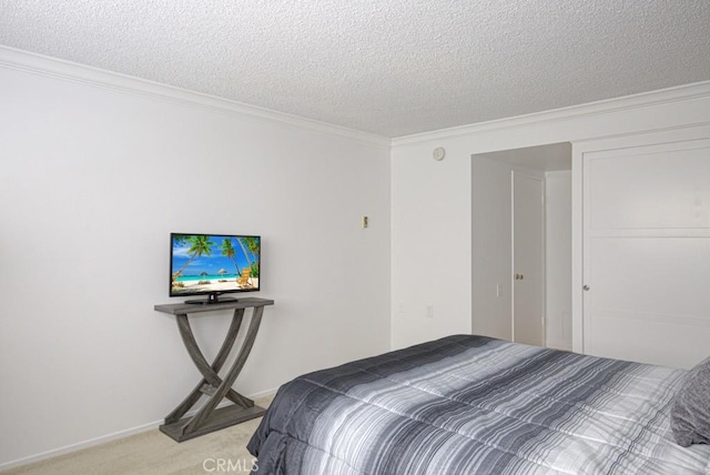 carpeted bedroom featuring crown molding and a textured ceiling