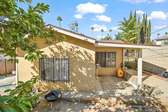 view of property exterior featuring a patio area